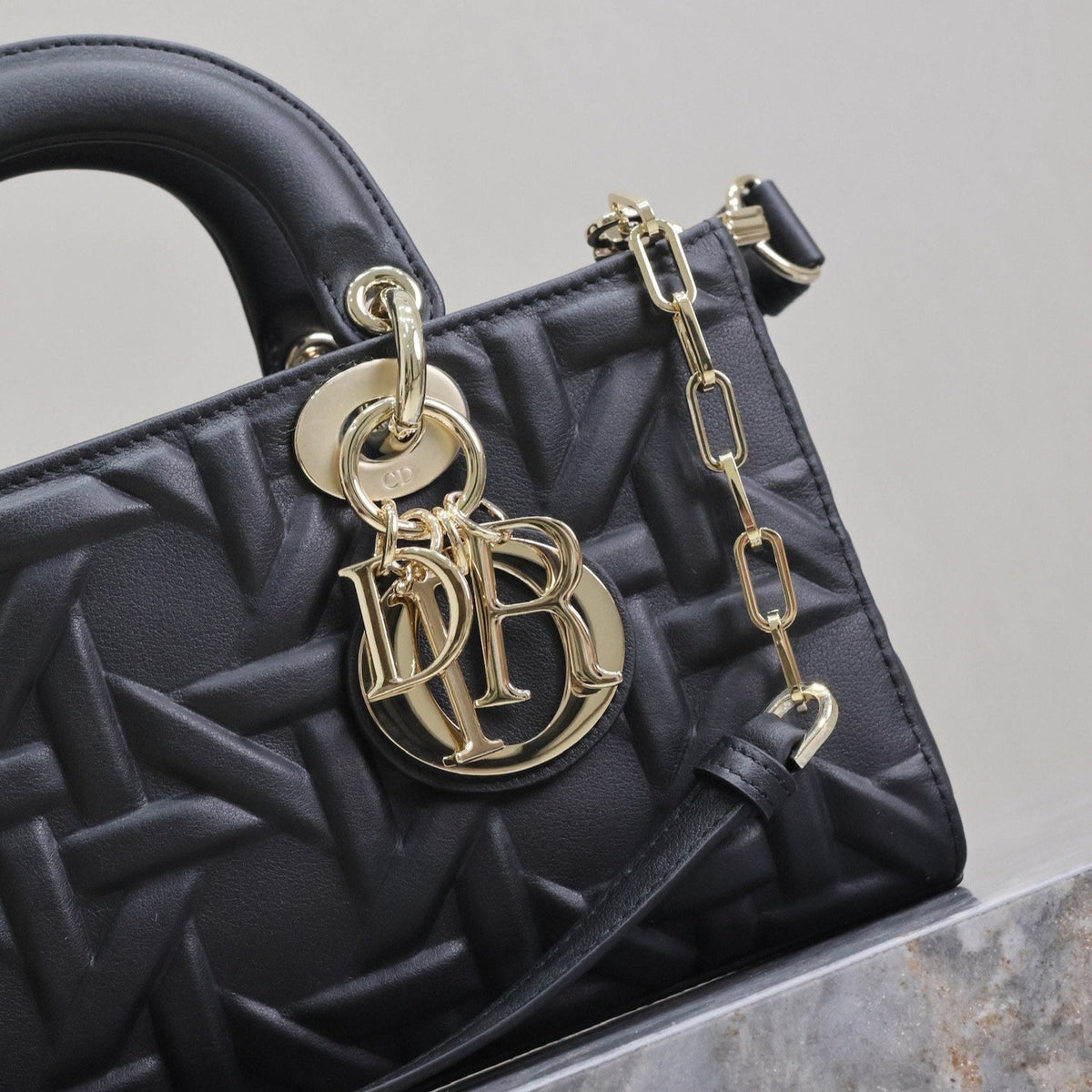 LADY D-JOY BAG 26 IN BLACK GRAPHIC CANNAGE CALFSKIN PALE GOLD-FINISH METAL CHARMS