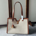 CABAS 37 IN WHITE CANVAS AND BRONZE BROWN CALFSKIN TRIM GOLD LOCK