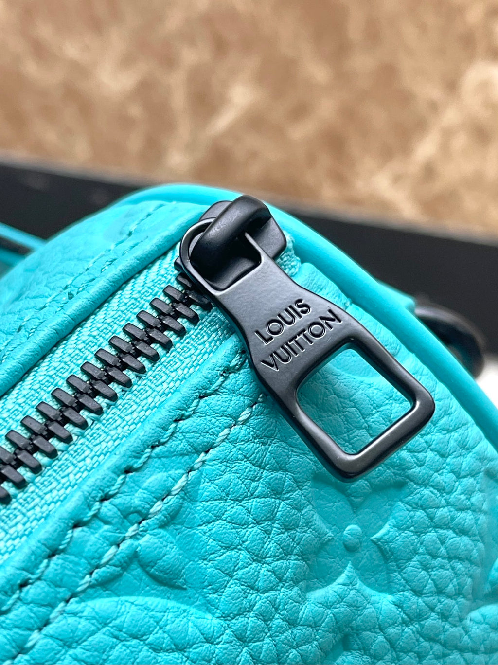 KEEPALL BANDOULIÈRE 25 IN TURQUOISE BLUE MONOGRAM EMBOSSED CALFSKIN